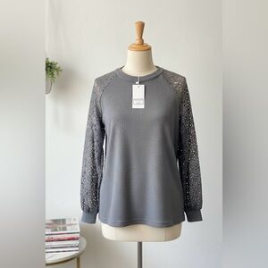 NWT MIHOLL Thermal Top with Lace Sleeves
Size: Large (L)
Condition: (NWT)
